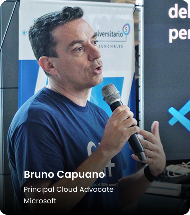 Bruno Capuano, Principal Cloud Advocate at Microsoft, speaking into a microphone at a tech event.